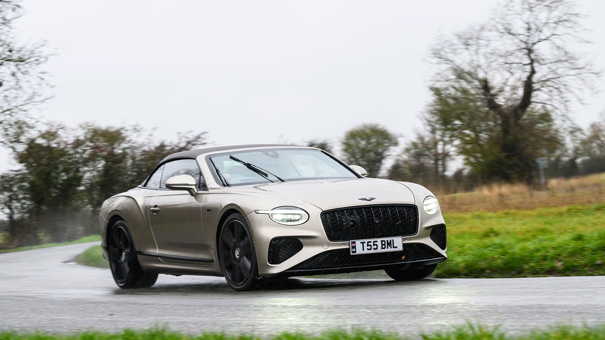 Bentley Continental GT Convertible (2025) review: front three quarter cornering, beige paint, roof up