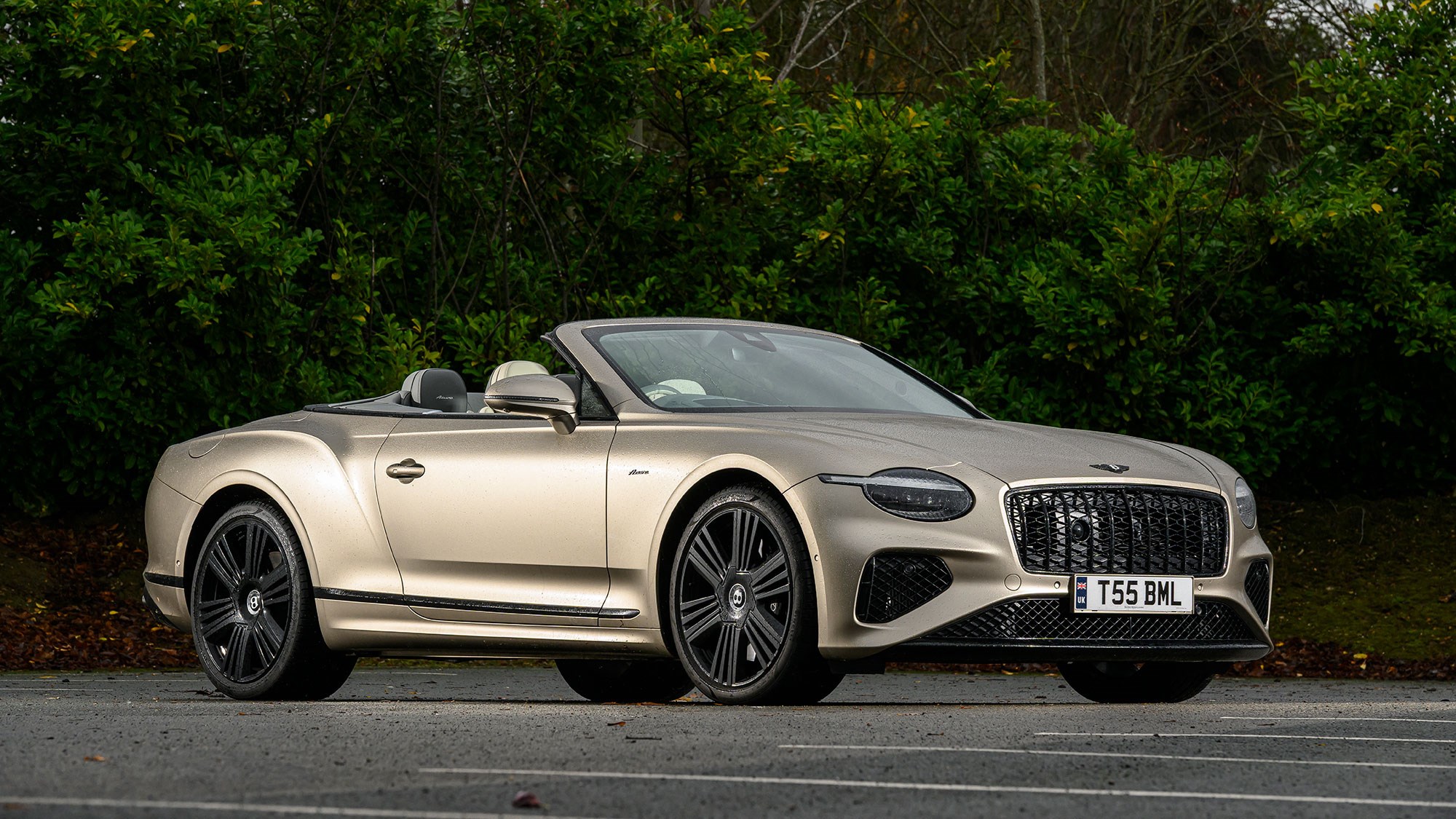 Bentley Continental GT Convertible (2025) review: front three quarter static, beige paint, roof down