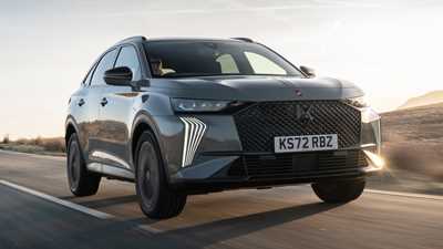 DS 7 (2023) review: front three quarter tracking shot, grey car