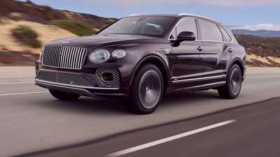 Bentley Bentayga EWB review - front view, driving, purple