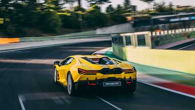 Lamborghini Revuelto rear three-quarter driving